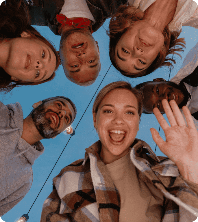 Group of friends taking a selfie together outdoors